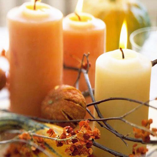 The attractive honey color of wax candles fits perfectly into the autumn composition - Thanksgiving Decorations For Home