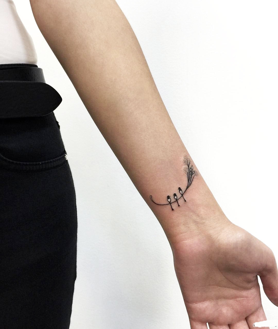 17 Meaningful Small Wrist Tattoos For Women in 2024 11