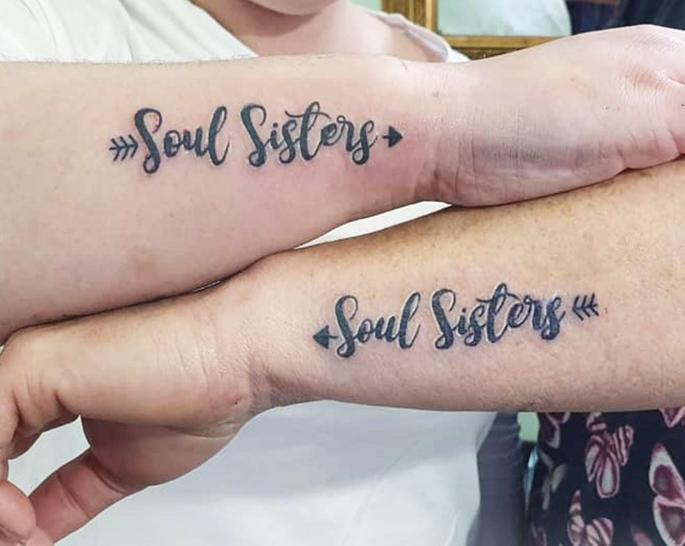 Soul sister tattoos: Symbols of an unspoken bond, etching the essence of deep friendship and kinship into skin.