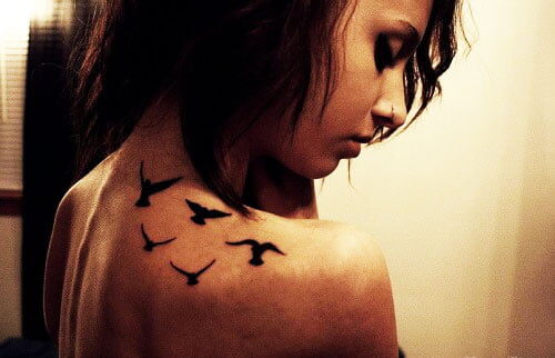 Bird tattoos on the shoulder: symbolic of freedom, grace, and the journey of the soul, taking flight on the canvas of skin. - Shoulder Tattoos For Women